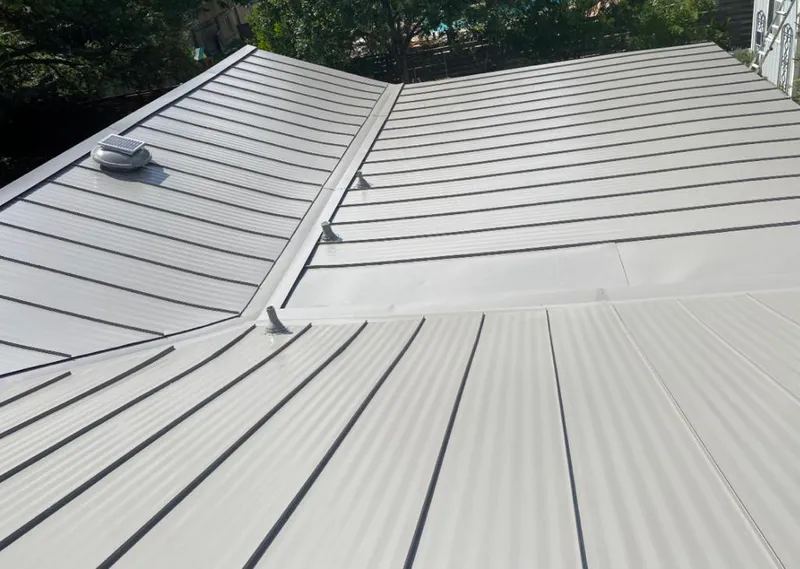 Solar attic fan installed on a metal roof for Roof Ventilation in Foster City